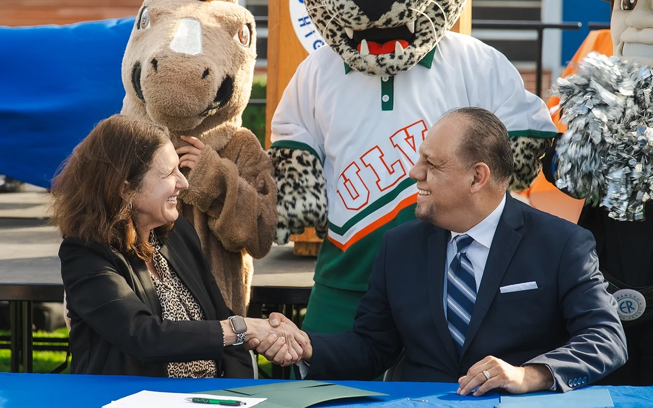 ULV President shaking hands with superintendent.